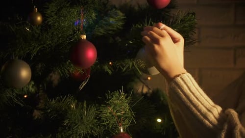 Decorating Christmas Tree at Home during Winter