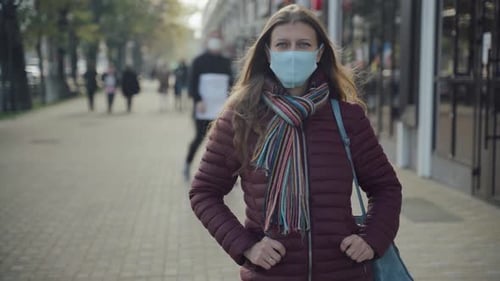 Woman Wearing Face Mask To Protect Against Covid-19 Virus Walking City