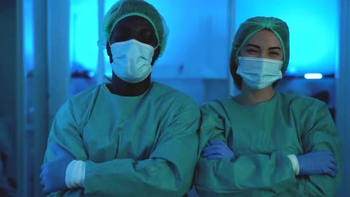 Two Medical Professionals Standing with Arms Crossed