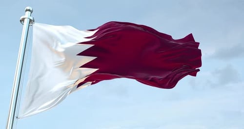 Realistic Waving Flag of Qatar Against Blue Sky