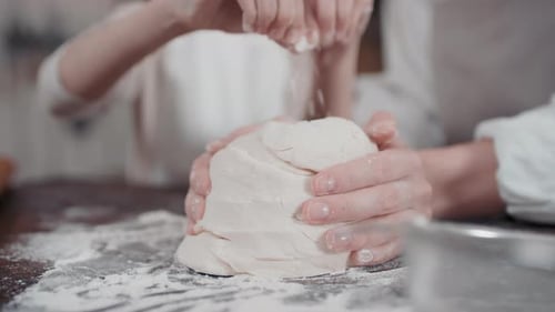 Hands Kneading Bread Dough