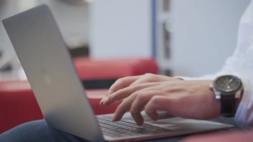 Close-up Of A Man's Hand Using Laptop