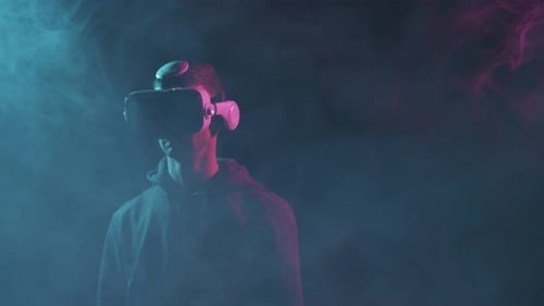 Person Wearing VR Headset in Smoky Room