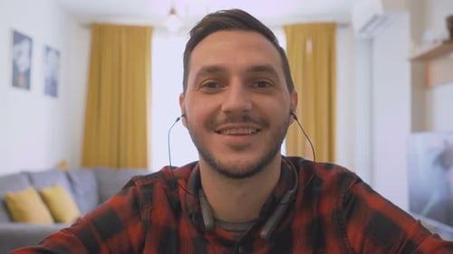 Cheerful Man Waving Hello at Home