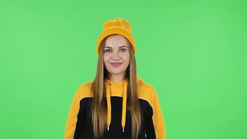 Portrait of Modern Girl in Yellow Hat with Shocked Surprised Wow Face Expression. Green Screen