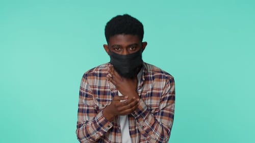Man Wearing Mask Coughing on Green Screen