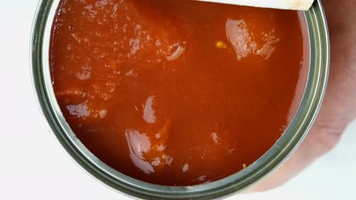 Opening a Can of Tomato Sauce Close Up