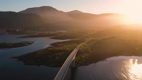 Flight over Fredvang bridge in the beautiful sunny evening, Lofoten Islands, Norway