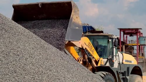 Front Loader Dumping Gravel at Construction Site