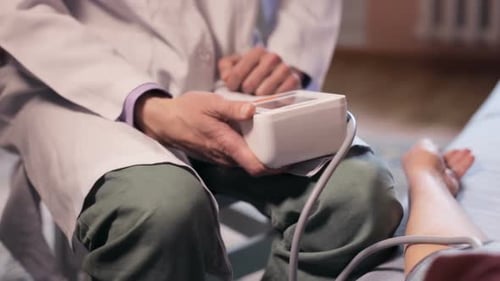 Doctor Taking Patient's Blood Pressure