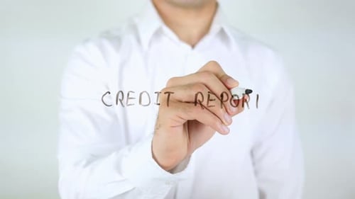 Adult Writes 'Credit Report' on Clear Surface