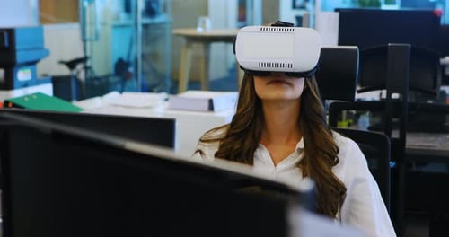 Young Woman Immersed in Virtual Reality at Office