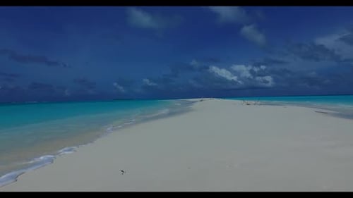 Aerial drone view sky of tranquil sea view beach break by clear water with white sandy background of