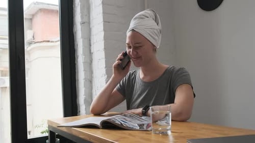 Woman Talking on the Phone Indoors