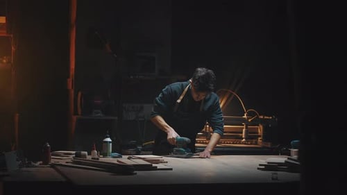 General Plan Cinematic Video of a Carpenter at Work in a Carpentry Workshop
