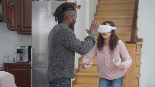 Young Adult Playing VR Game with Friend