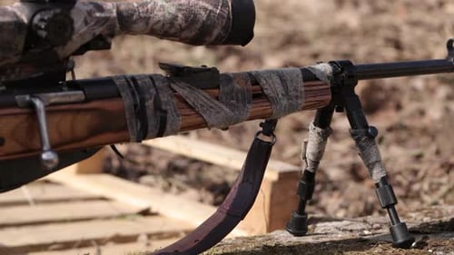 Rifle on Tripod outdoors in the daytime