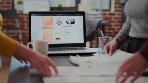 Team Analyzing Business Data in Modern Office