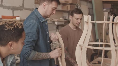 Woodworkers Building Furniture in Workshop