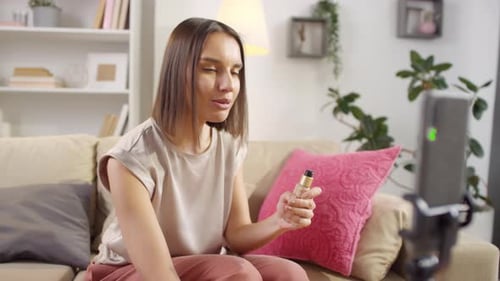 Young Woman Making a Makeup Tutorial Video