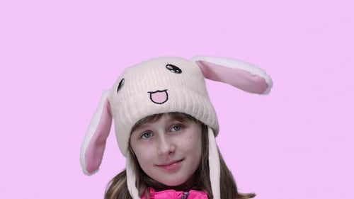 Girl Smiling Wearing a Bunny Hat