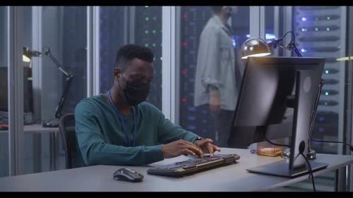 Young Man Working in Data Center
