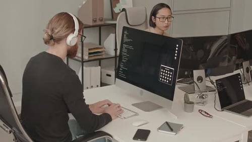 Male Team of Programmers Working in Office