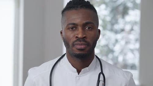Man in White Coat with Stethoscope Close Up