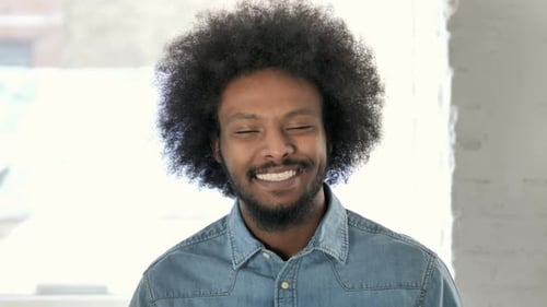 Man With Curly Hair Smiling Close Up