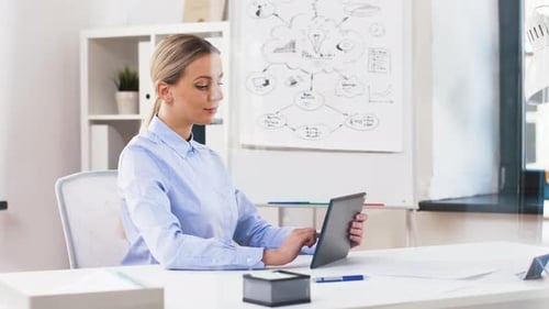 Businesswoman with Tablet Computer Works at Office 44
