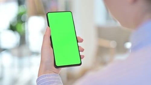 Rear View of Female Using Smartphone with Chroma Screen