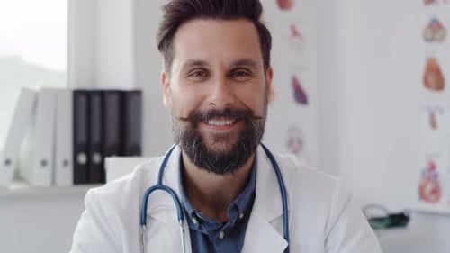 Handheld view of confident doctor at work