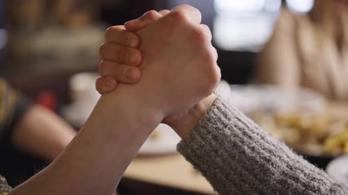 Hands Clasping Firmly in Handshake Close Up