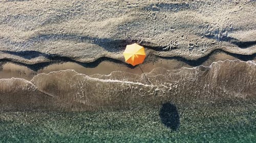Isolated Beach Umbrella Near the Sea at Summer
