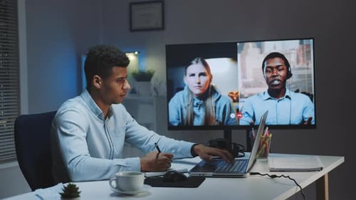 Young Adult in Video Conference at Night
