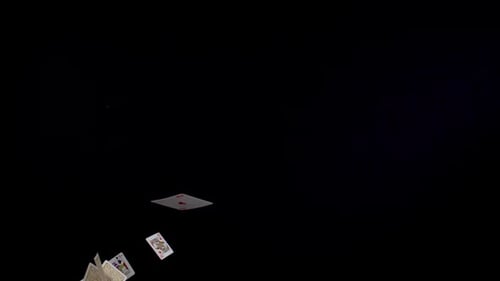 Playing Cards Falling in Slow Motion on Black