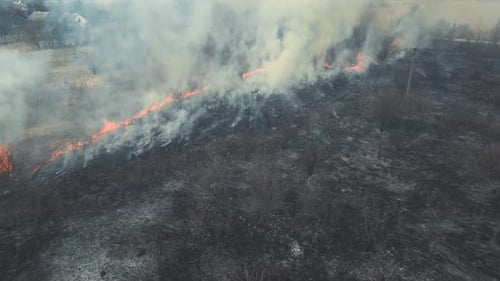 Wildfire Burns Across Rural Field