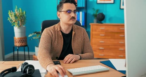 Accountant in Glasses Employee of Company's Accounting Statistics Department Checks Accuracy of