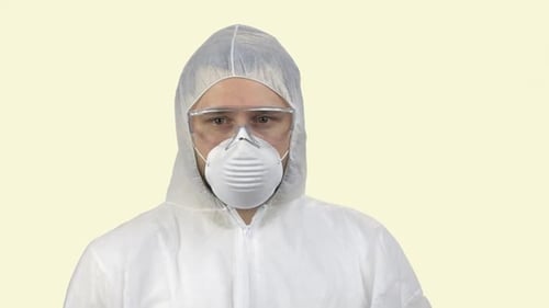 Man Wearing Protective Suit and Face Mask