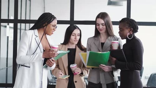 Businesswomen Collaborating in Bright Modern Office