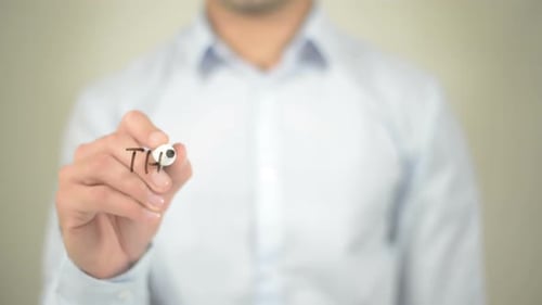 Writing Think Creatively with Marker on Clear Surface