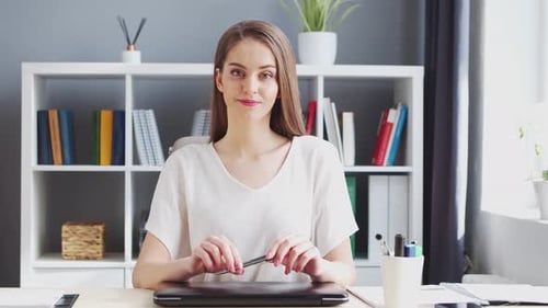 Young Woman Works at Home Office Using Computer.