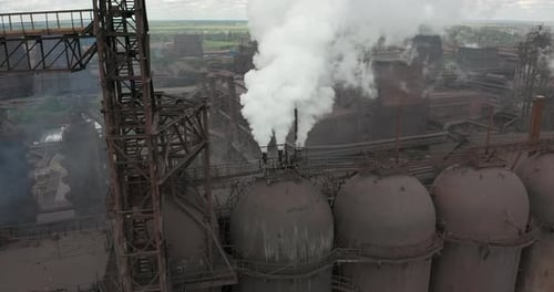 Epic Aerial of Pipes with White Smoke Emission. Plant Pipes Pollute Atmosphere. Industrial Factory