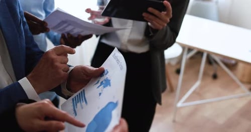 Multiracial business people working inside bank office