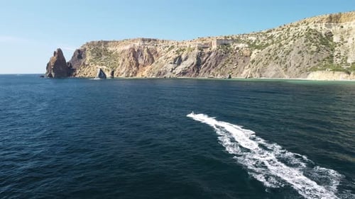 Jet Ski Ride on the Ocean near Rocky Coastline