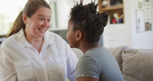Woman and Child Smiling and Touching Foreheads