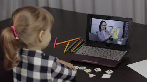 Child Learning Online with Teacher via Laptop