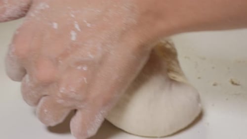 Dough manually bake job close-up 4K 2160p UHD footage - Bakery work with dough with slow panning 4