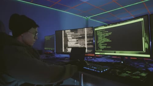 Asian Programmer Working at Night