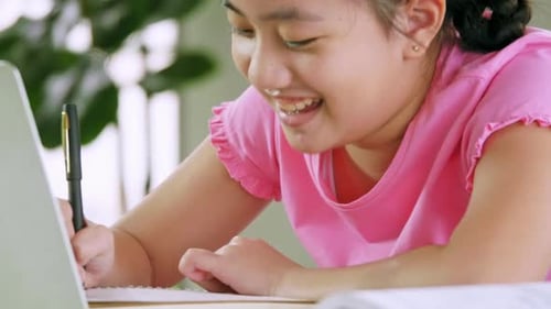 Girl Studying and Doing Homework with Computer